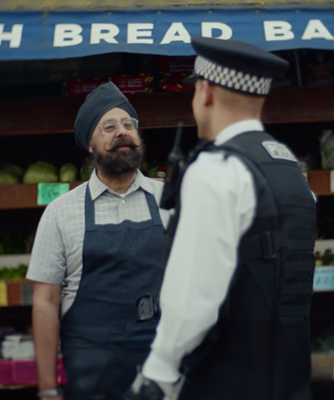 Met officer talking with man