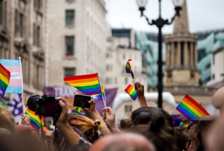 people celebrating at the London Gay Pride parade in the city centre.